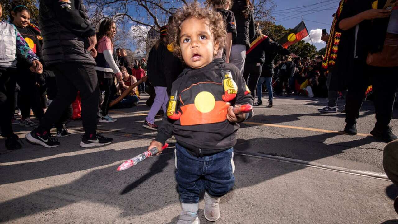 Brian Liddle Jr participates in a NAIDOC week march in Melbourne in 2018
