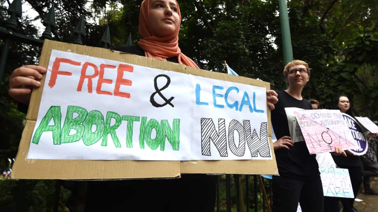 Abortion pro-choice supporters rally outside Queensland Parliament