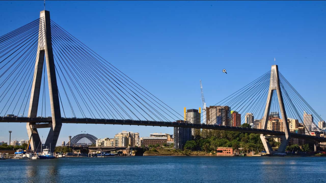 Both the Australian Flag and New Zealand Flag atop the ANZAC Bridge.