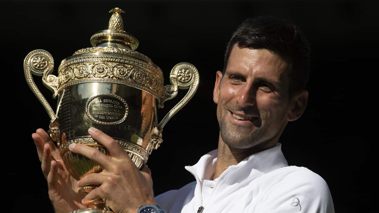 Novak Djokovic holds the Wimbledon men's singles trophy