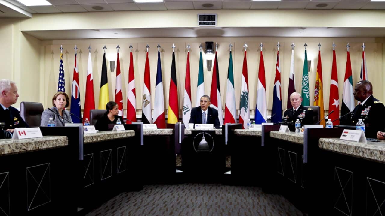 US President Barack Obama (C) with military leaders of the coalition