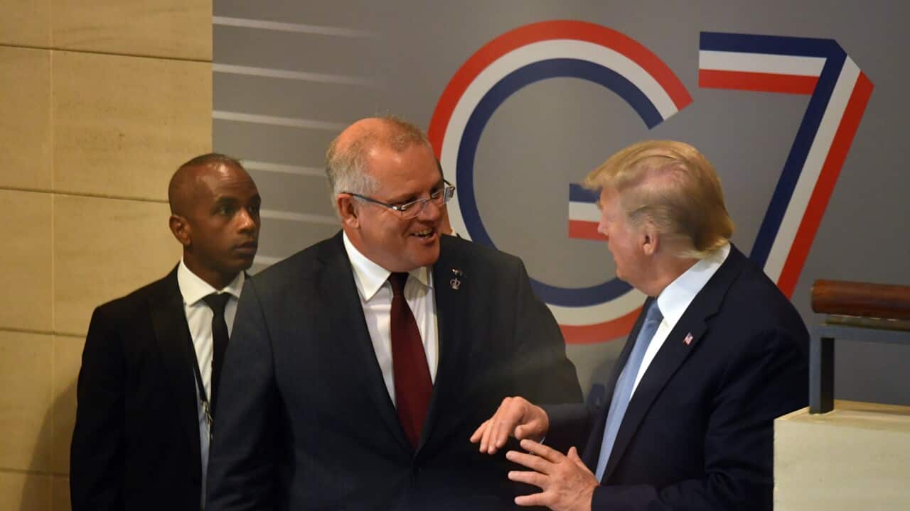 U.S. President Donald Trump and Australia's Prime Minister Scott Morrison leave together after a meeting during the G7 Summit in the town of Biarritz, 800km south of Paris in France, Sunday, August 25, 2019. (AAP Image/Mick Tsikas) NO ARCHIVING