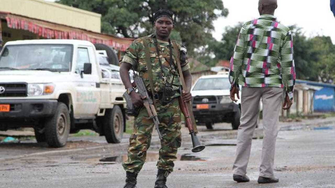 Burundian soldier with his gun and rocket launcher guards a street in Bujumbura, Burundi.