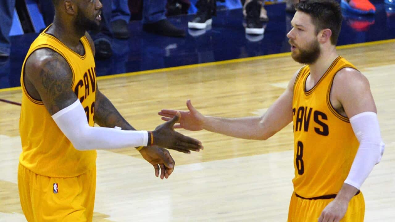 Cleveland Cavaliers guard Matthew Dellavedova (R) and LeBron James