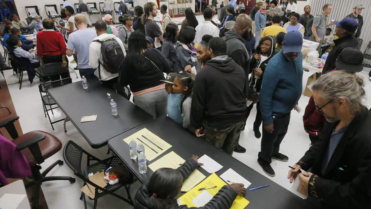 The wait time to vote at the Pittman Park precinct in Atlanta was reported to be three hours. Pizza and snacks were donated for the people waiting in line.