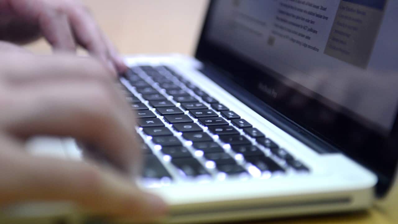 A person uses a laptop computer