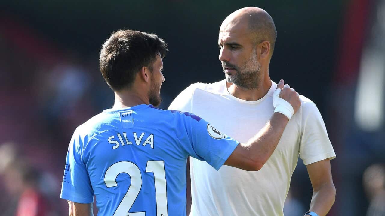 David Silva alongside Manchester City manager Pep Guardiola