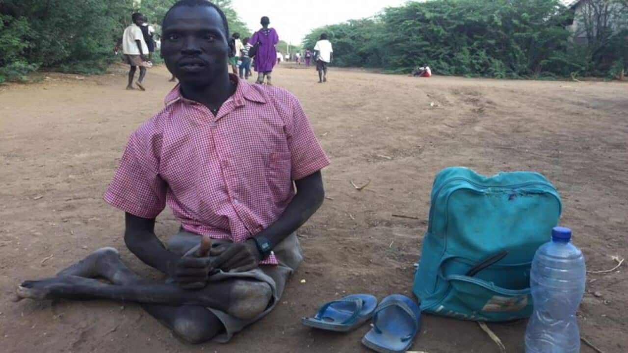 Machar Atem Mabany on his way to school