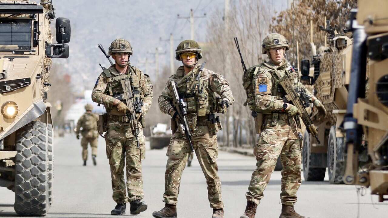 British soldiers stand guard at the site where gunmen attacked a political gathering in Kabul, Afghanistan, 06 March 2020. According to media reports, at least one person was killed and 15 were injured in the shooting.