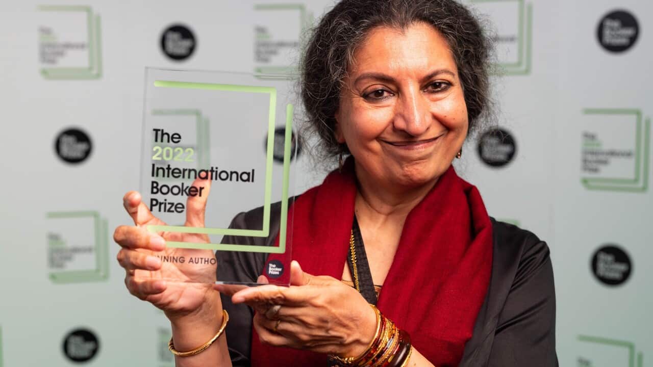 Geetanjali Shree holds the Man Booker prize award.