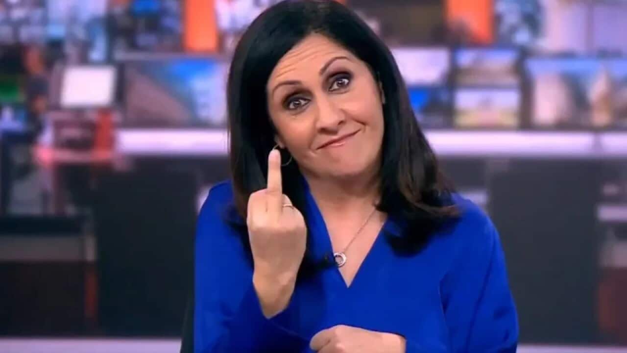 A news presenter giving the middle finger live on-air.