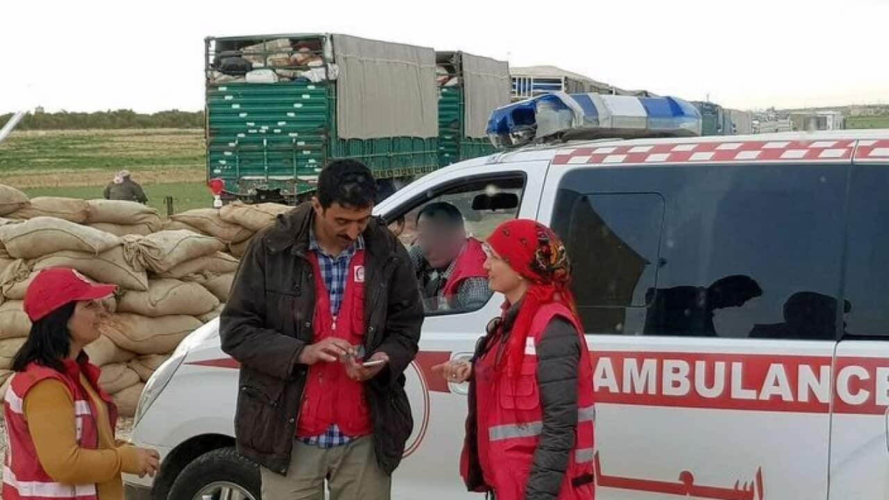 Dr Nemam Ghafouri (right) with aid workers