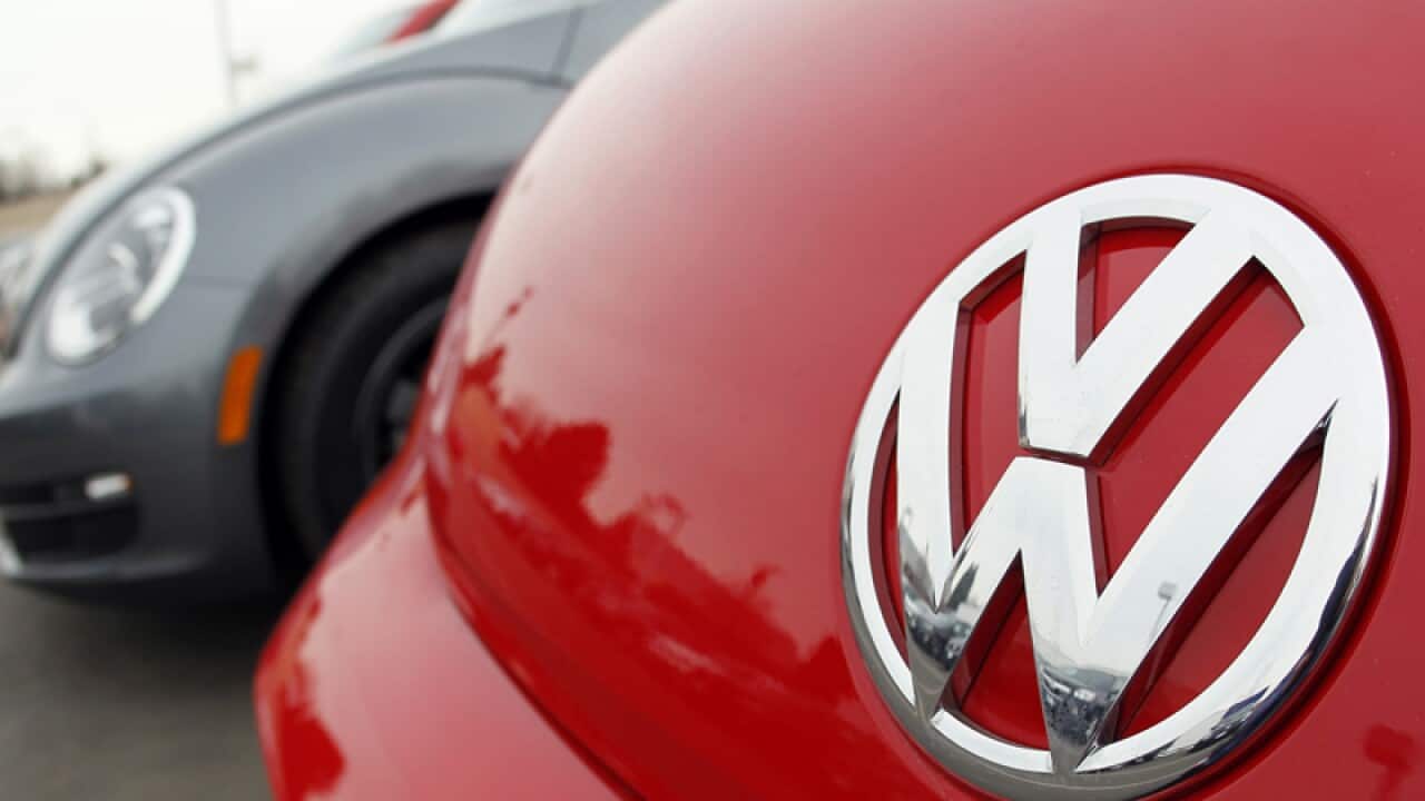 The Volkswagen logo in the hood of a 202 Beetle