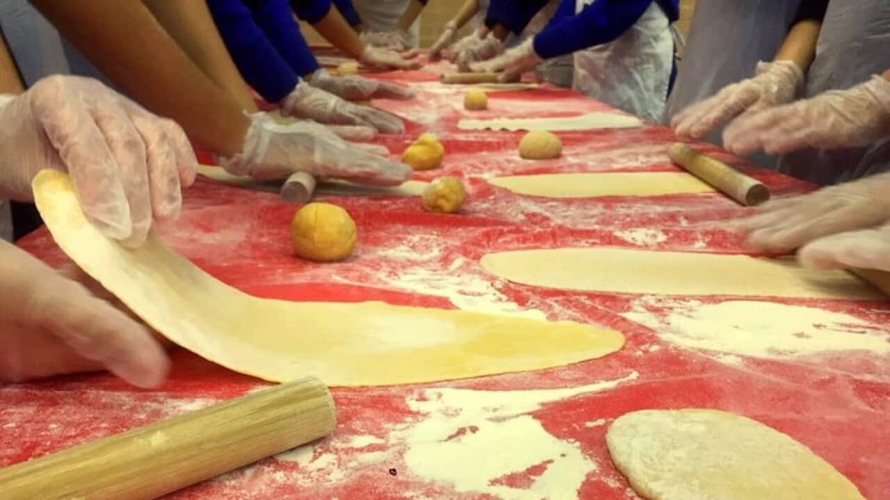 Luca Roncari and schoolkinds at work