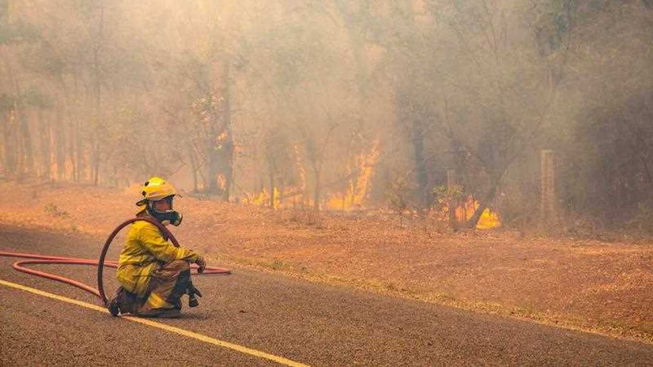 Firefighters working to control a bushfire in Deepwater, Central Queensland.