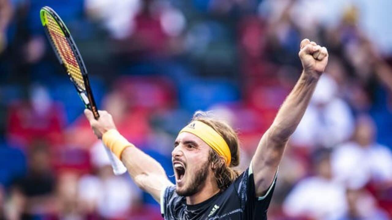 Stefanos Tsitsipas celebrates victory over Novak Djokovic at the Shanghai Masters.