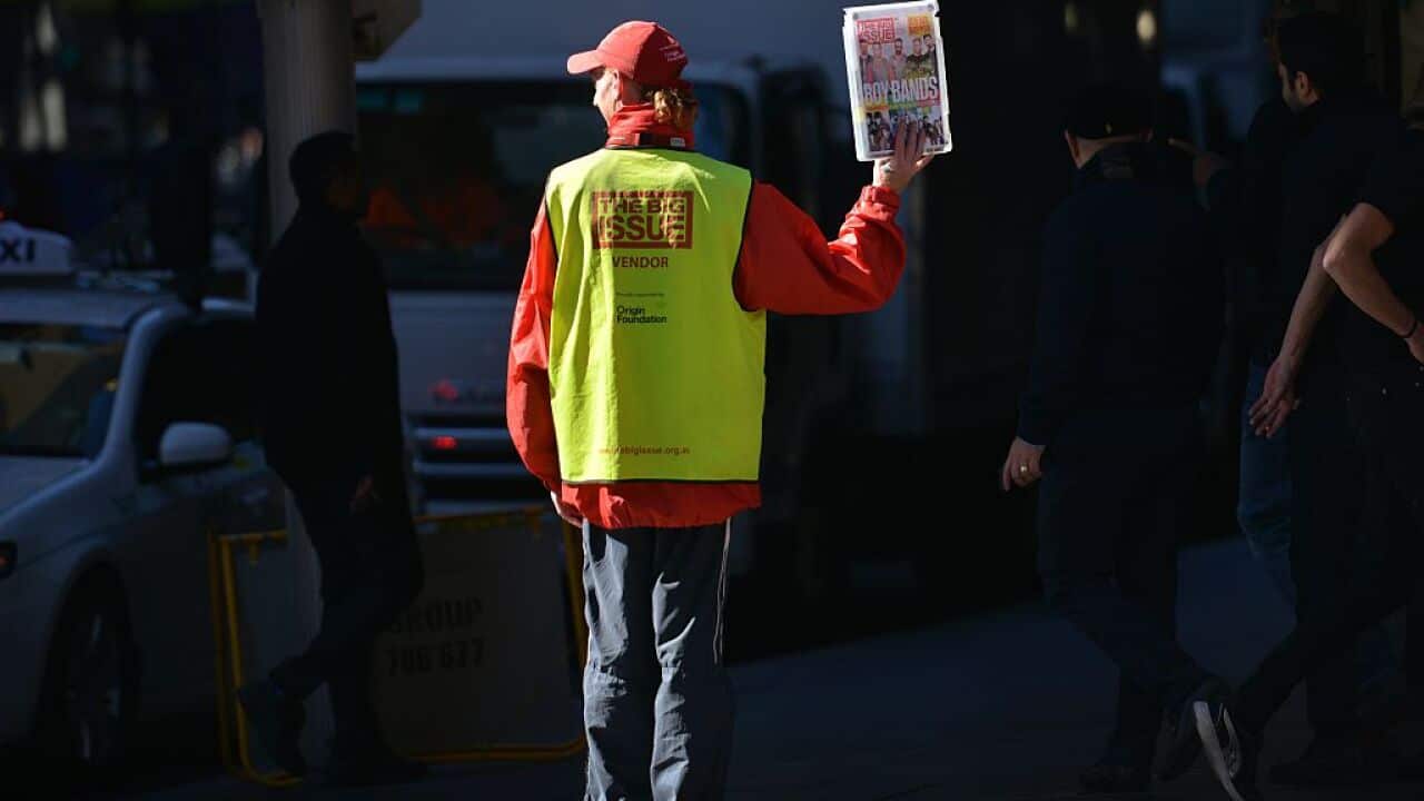 A Big Issue vendor at work.