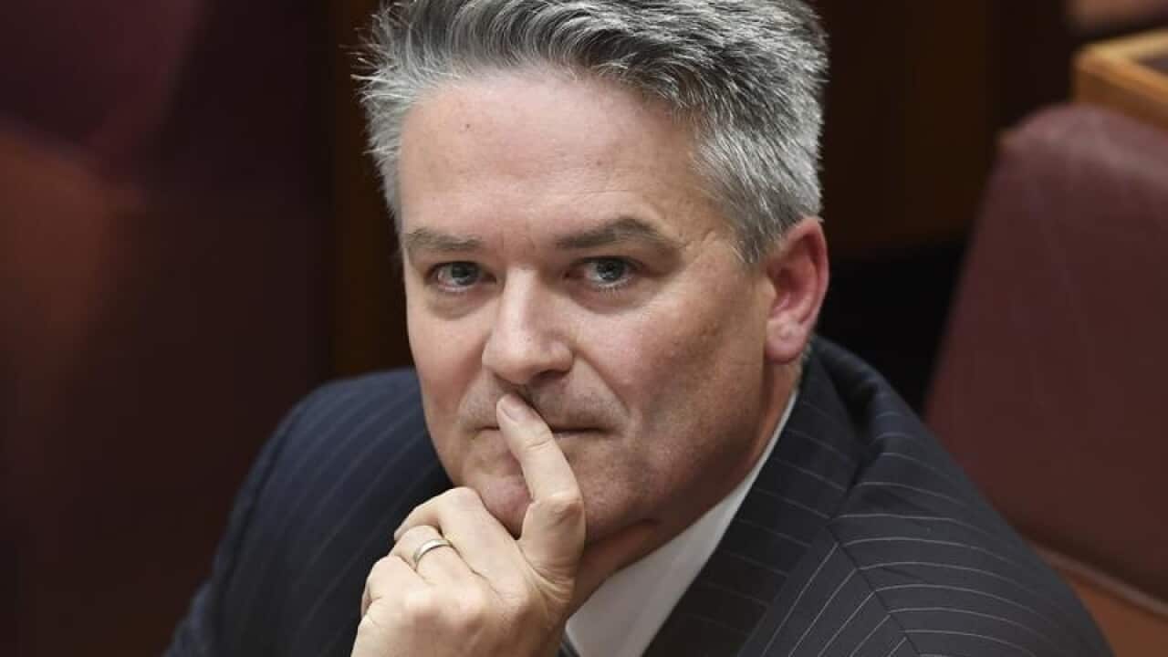 Mathias Cormann reacts during Senate Question Time
