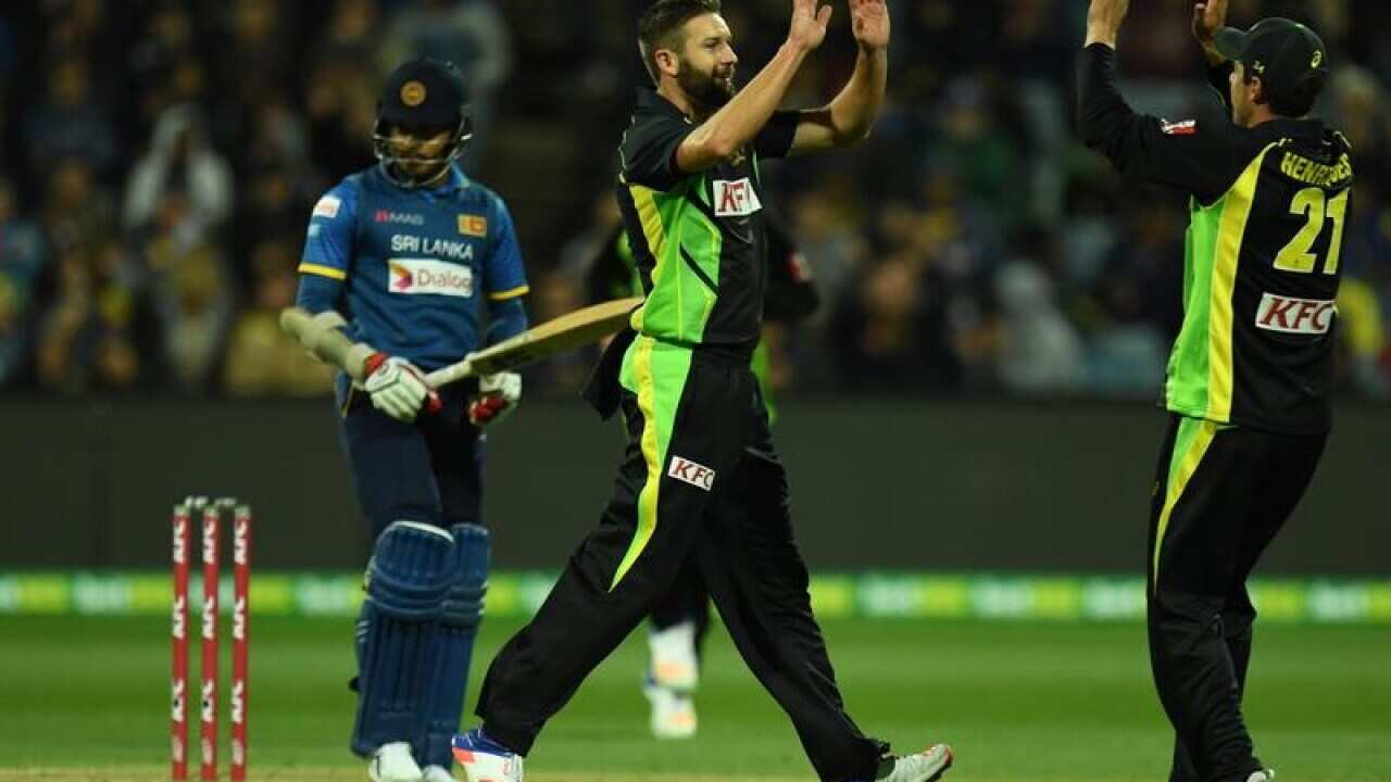 Andrew Tye of Australia takes a wicket.