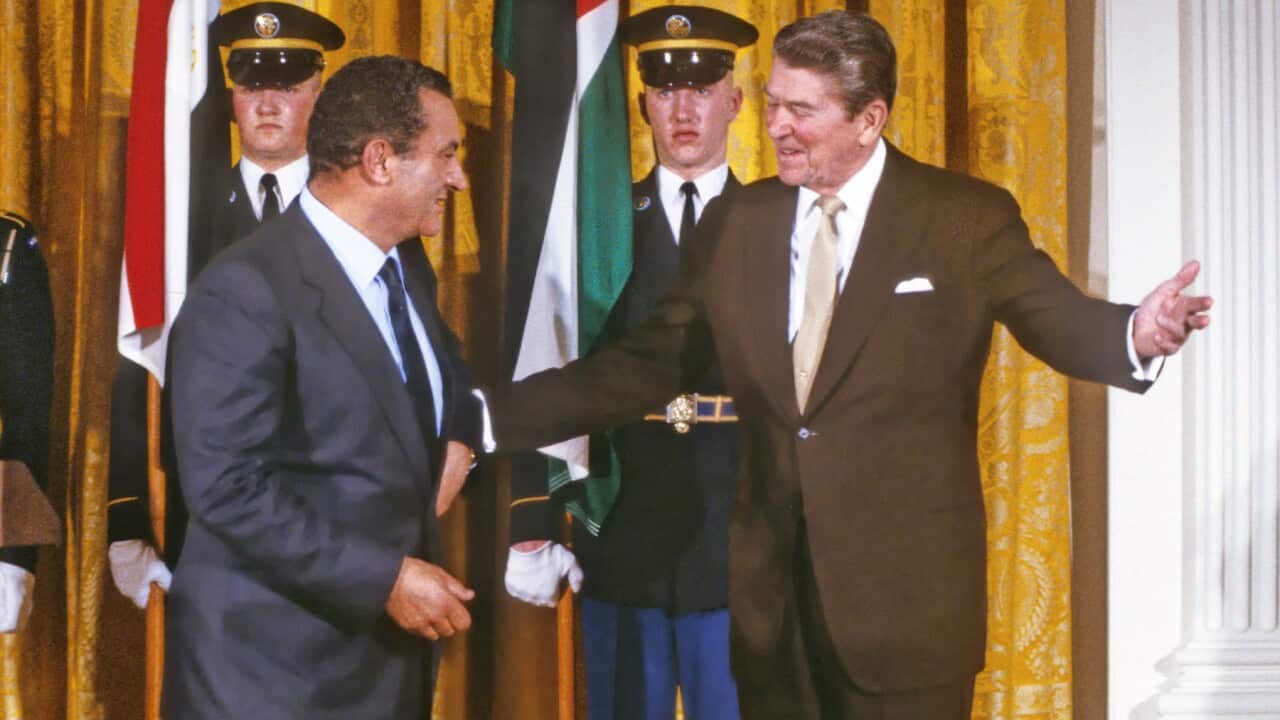 United States President Ronald Reagan, right, escorts President Hosni Mubarak of Egypt, left, following remarks in the East Room of the White House in Washington, D.C. on February 14, 1984..Credit: Arnie Sachs / CNP/Sipa USA