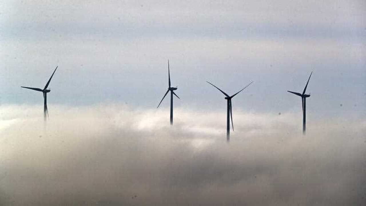 File photo dated 15 Jan 2021 of wind turbines sticking out through low lying clouds over Lancashire - Peter Byrne PA Wire.jpg