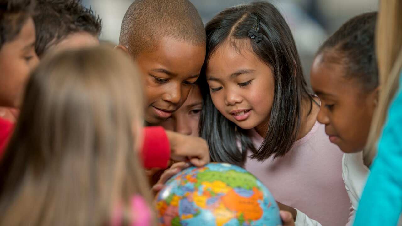 Learning Geography by Looking at the World