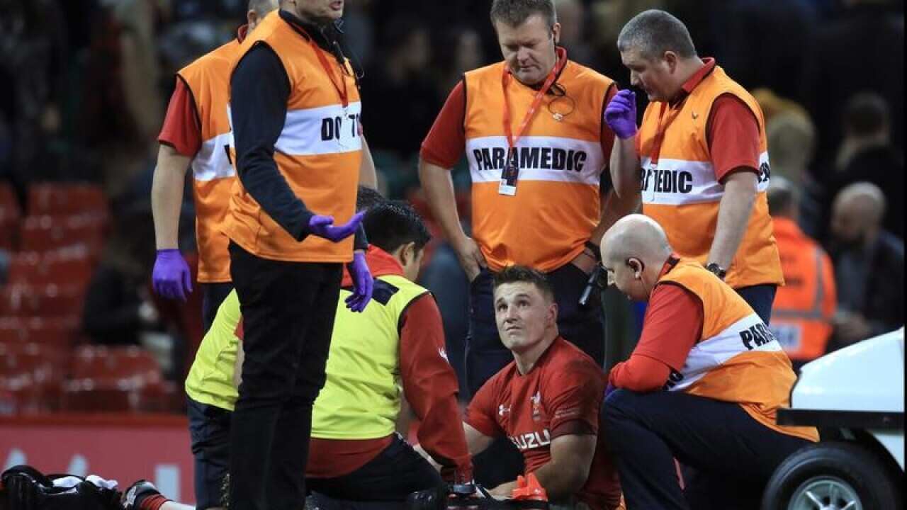 Jonathan Davies gets some medical attention.