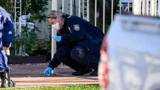 NSW Police and forensics establish a crime scene outside a home.