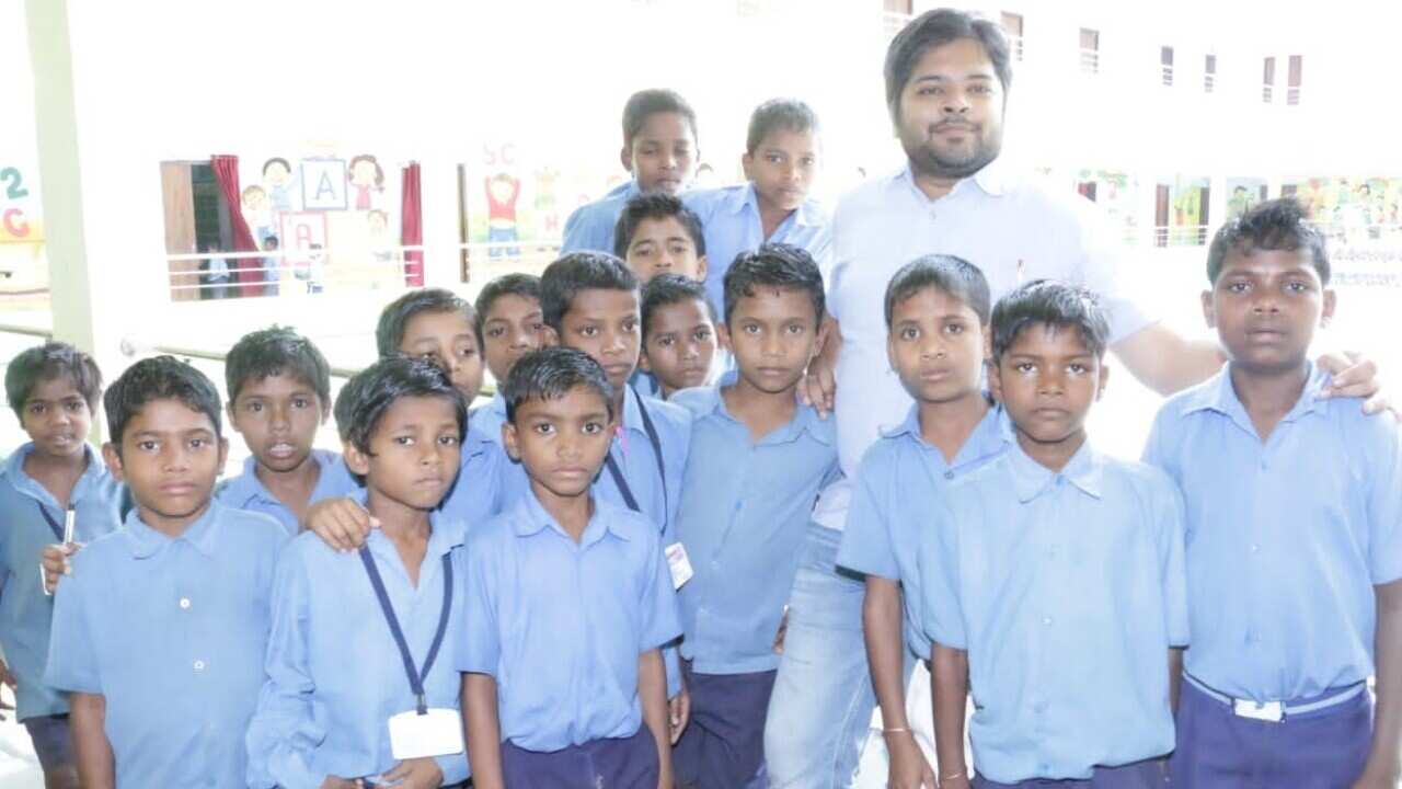 Social activist Ashish Shrivastava with students at a Chhattisgarh school.