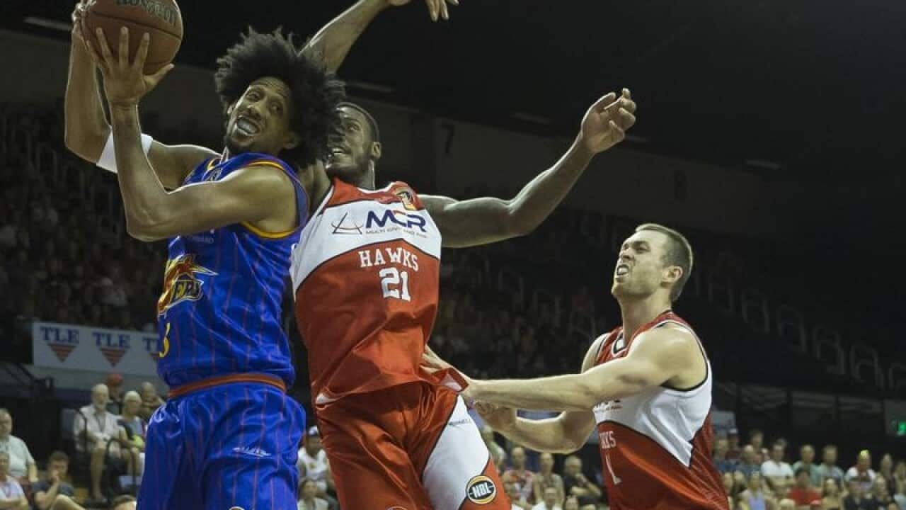 Joss Childress of the 36ers and Delvon Johnson of the Hawks