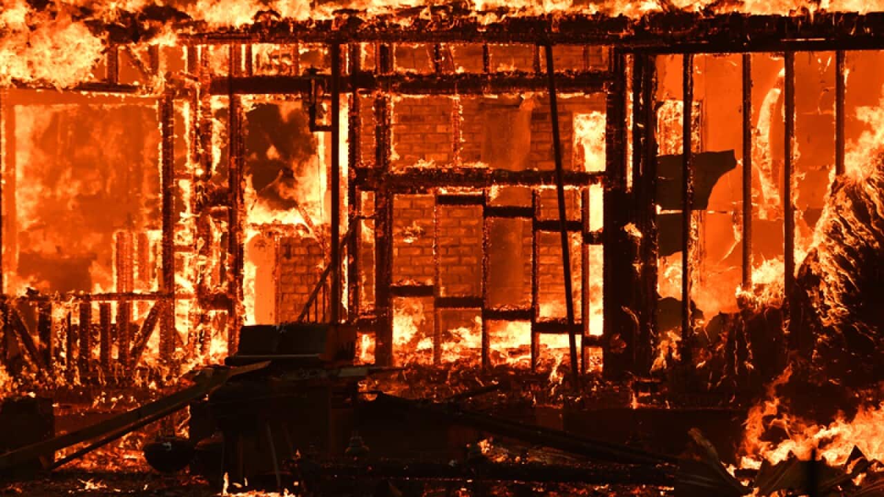 A home burns near the town of Lower Lake, California