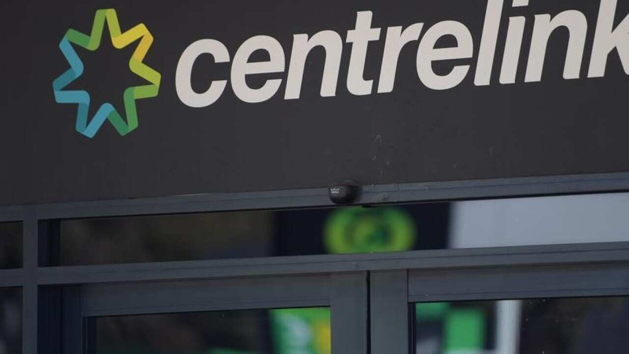 A Centrelink sign and logo above a door