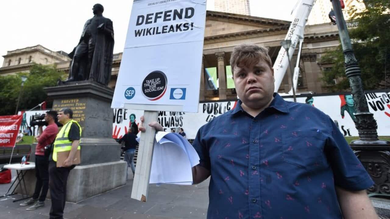Supporters of Julian Assange rally outside the Victorian State Library in Melbourne on Fri, Apr 12
