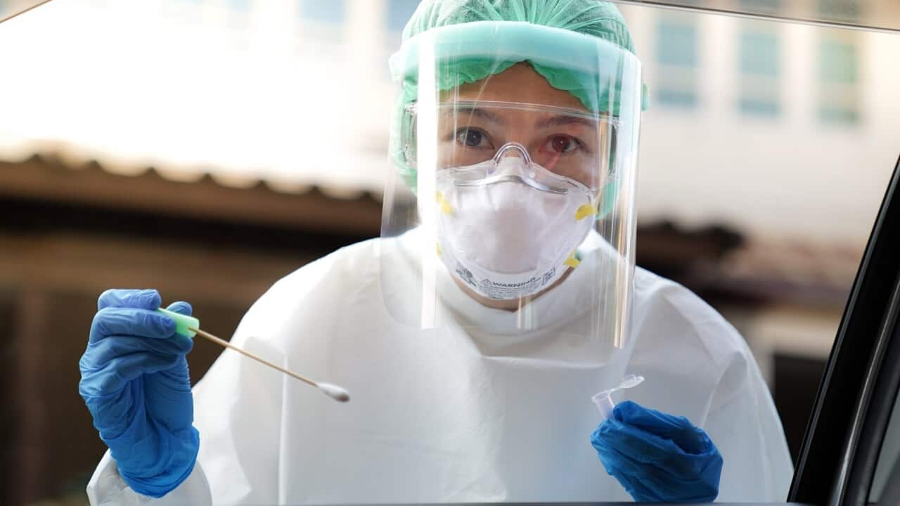 A health worker preparing to carry out a COVID-19 test