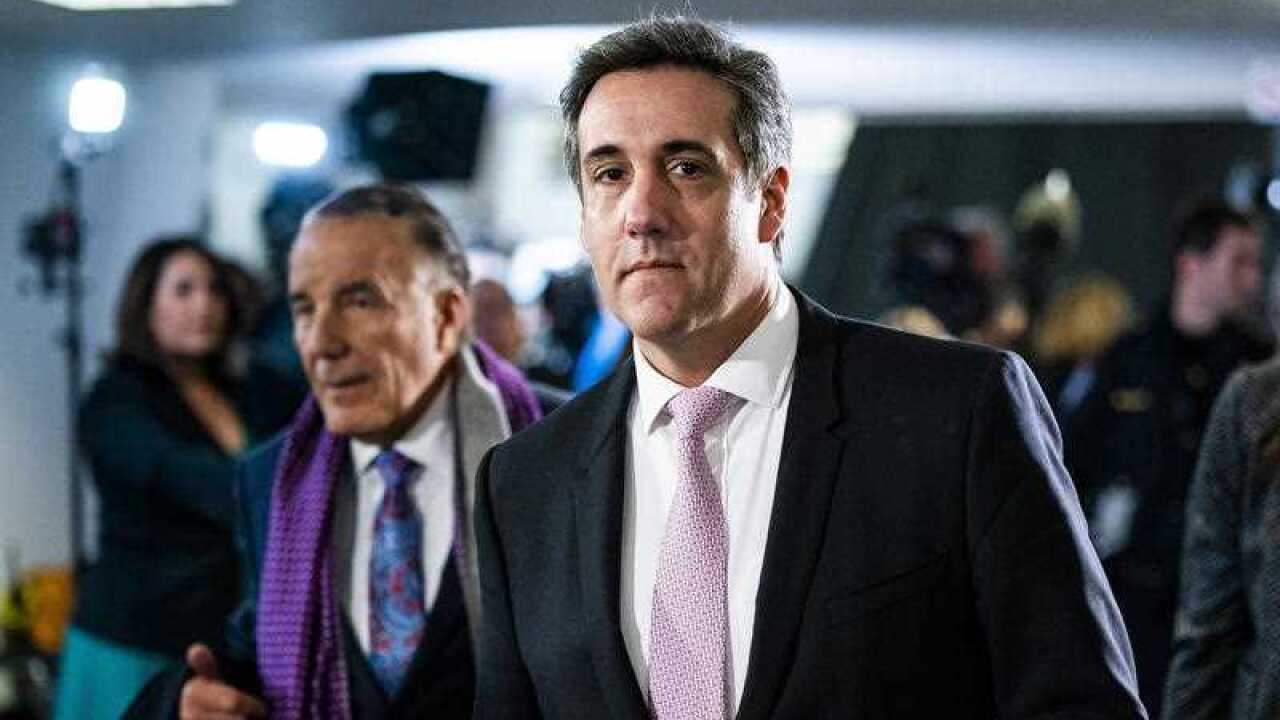 Michael Cohen departs after testifying privately before the Senate Intelligence Committee.