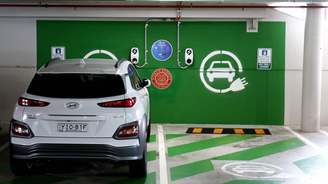 An electric vehicle parked at a charging station.