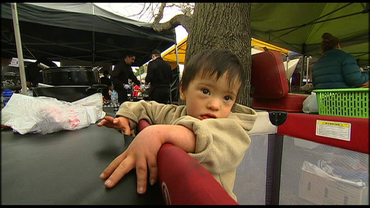 Jackie Macedo says while her baby Noah is well cared for and loves coming to work with her, she's given in to years of pressure. (SBS