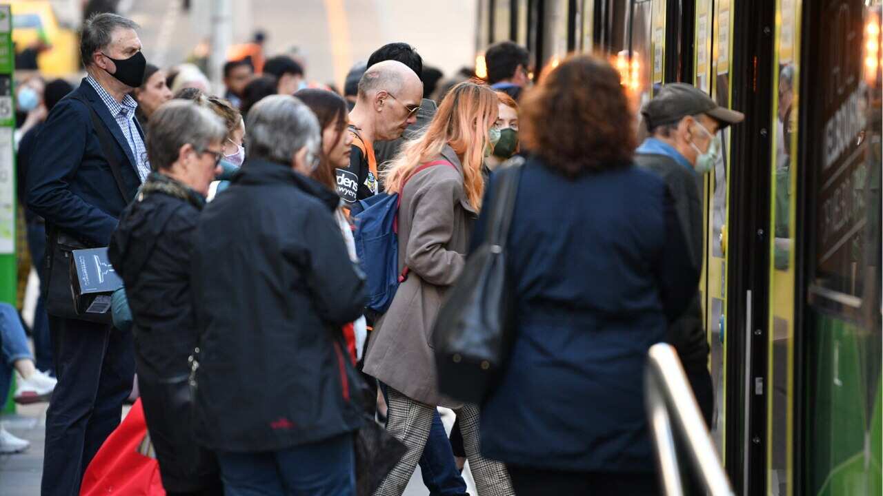 Passengers board public transport in Melbourne