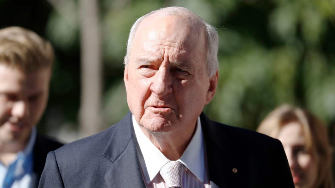 Alan Jones talks to the media.