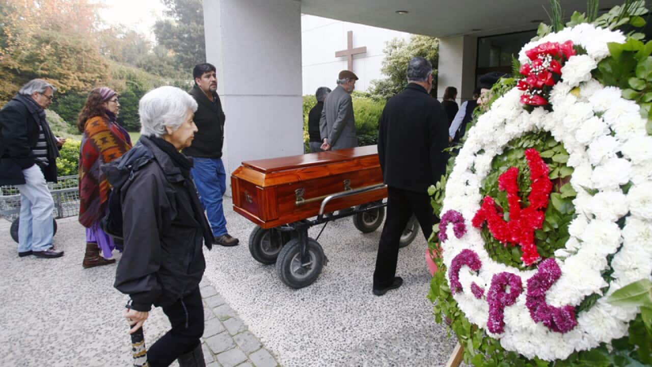 The coffin with the remains of Margot Honeker arrives to her funeral