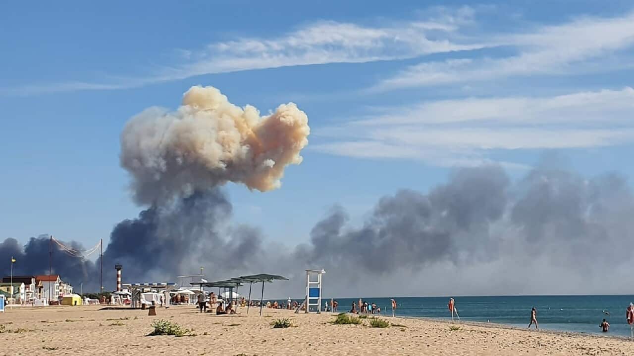 Rising smoke can be seen from the beach at Saky after explosions were heard from the direction of a Russian military airbase