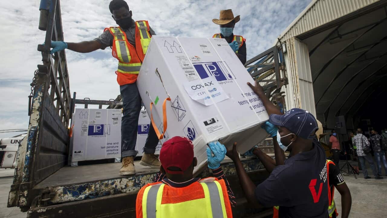 Boxes of AstraZeneca COVID-19 vaccine, delivered through the COVAX global initiative, are unloaded in Mogadishu, Somalia.