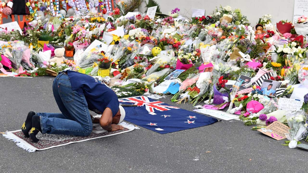 A muslim worshipper prays at a makeshift memorial at the Al Noor Mosque on Deans Rd in Christchurch on 19 March, 2019.