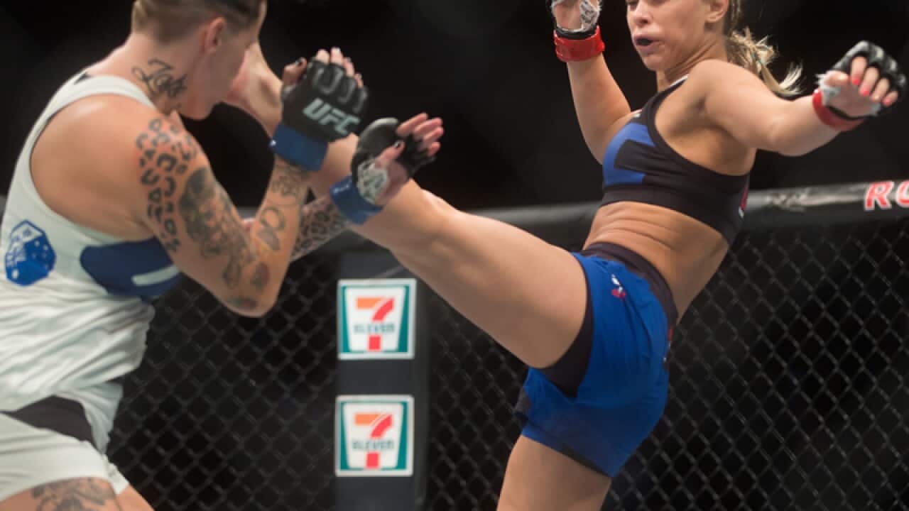 Paige VanZant (R) of the United States, and Bec Rawlings, of Australia