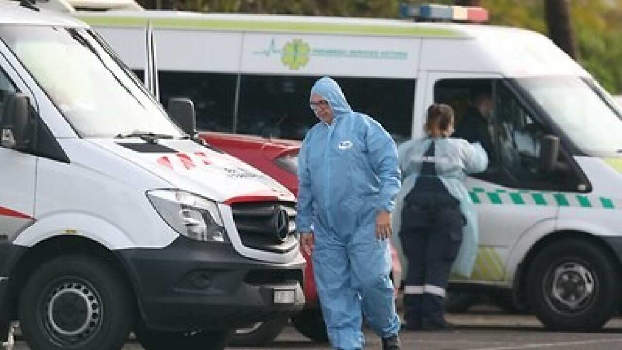 Medical staff outside St Basil’s Home for the Aged Care in Fawkner,
