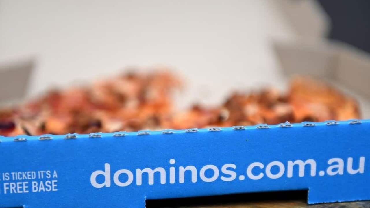 A pizza is seen at a Domino's Pizza store