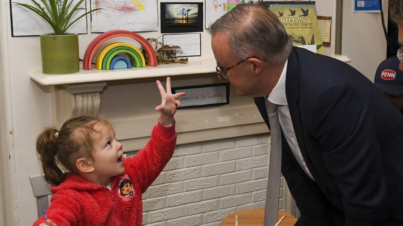 Anthony Albanese speaks to a child during a visit to an Early Learning Childcare Centre in Sydney