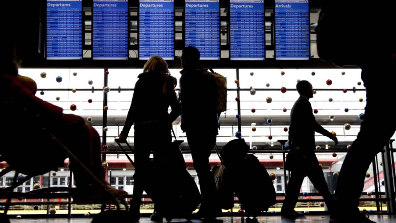 Travellers at O'Hare International Airport in Chicago
