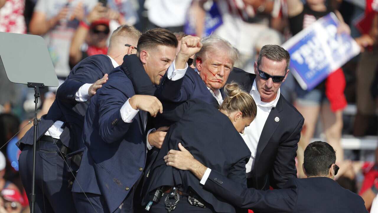 Former US President Donald Trump rushed off stage after incident at campaign rally