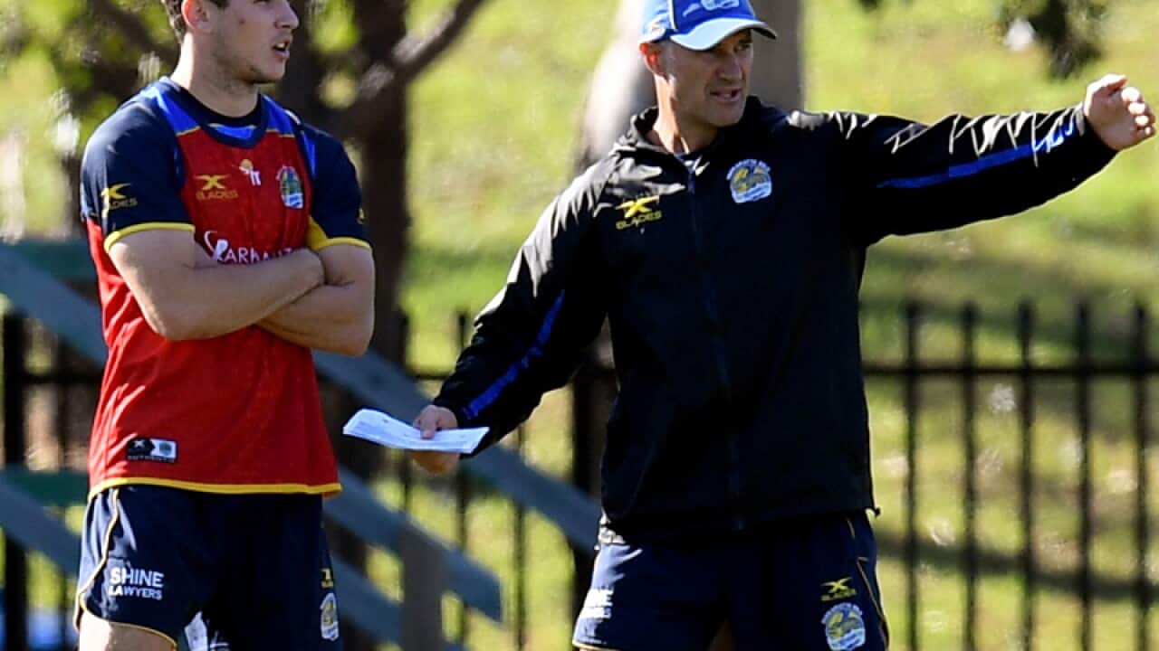 Mitchell Moses (L) chats with coach Brad Arthur
